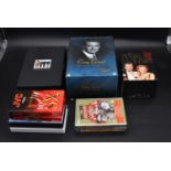 The boxed Cary Grant movie collection along with other dvd's. H.28 W.18 D.13cm (10)
