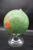 A vintage light up globe on chrome base. H.40 Dia.20cm (base)