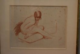 A crayon study of a female nude figure, indistinctly signed. H.40 W.48cm