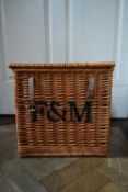 A contemporary wicker hamper basket marked F & M. H.38 W.39 D.39cm