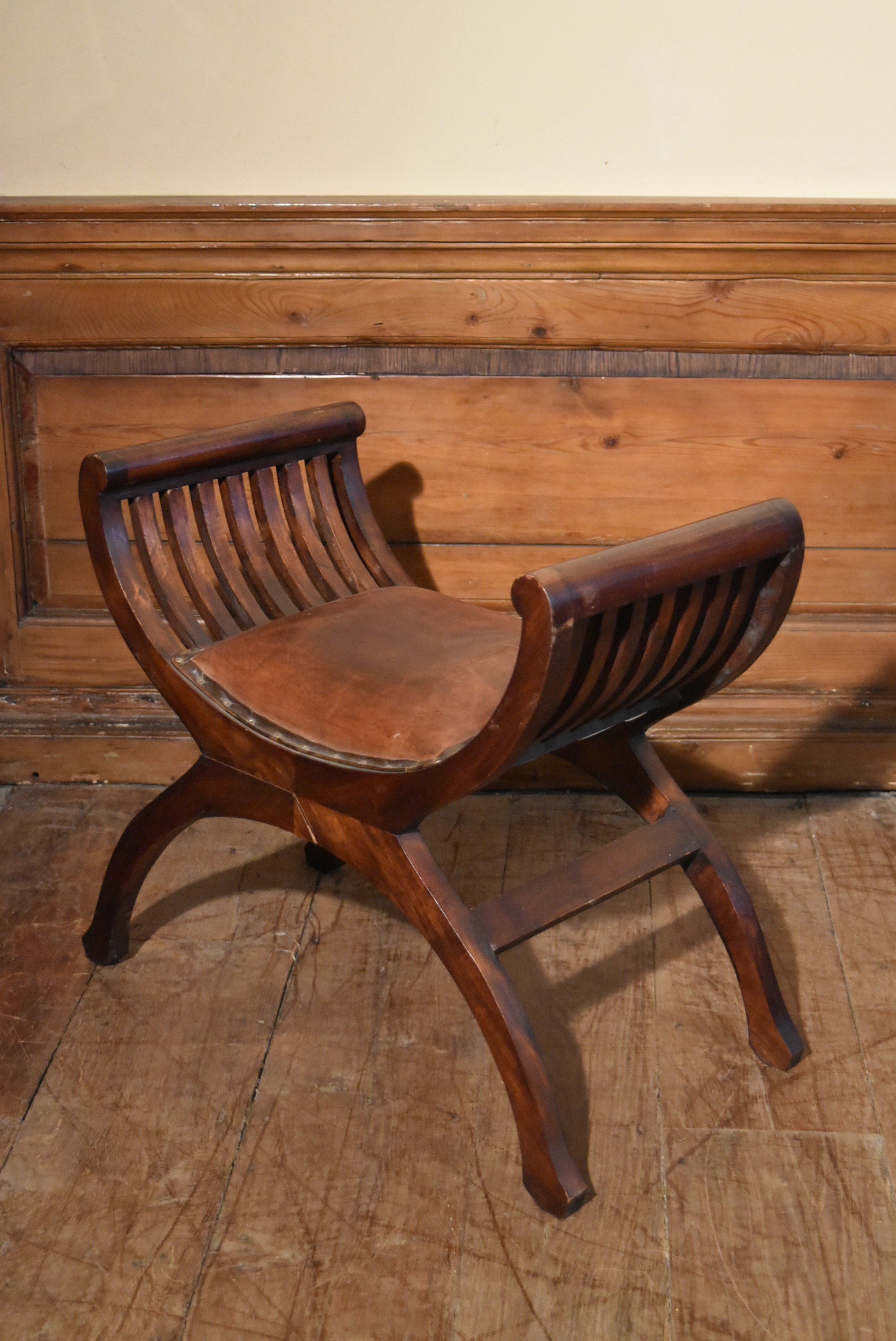 A contemporary teak X framed stool in leather upholstery. H.60 W.56 D.37cm - Image 5 of 5