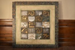Framed sculpted abstract forms on tooled metal block grid within heavy metal frame. H.124 W.122cm
