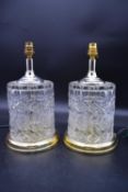 A pair of cut crystal table lamps on gilt metal bases. H.33 Dia.18cm (2)
