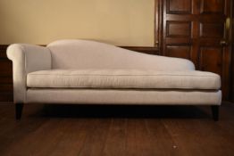 A contemporary chaise longue in buttoned calico raised on tapering square supports. H.80 W.190 D.