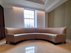 A large contemporary two section arc shaped banquette sofa in calico upholstery. 460cm, length of