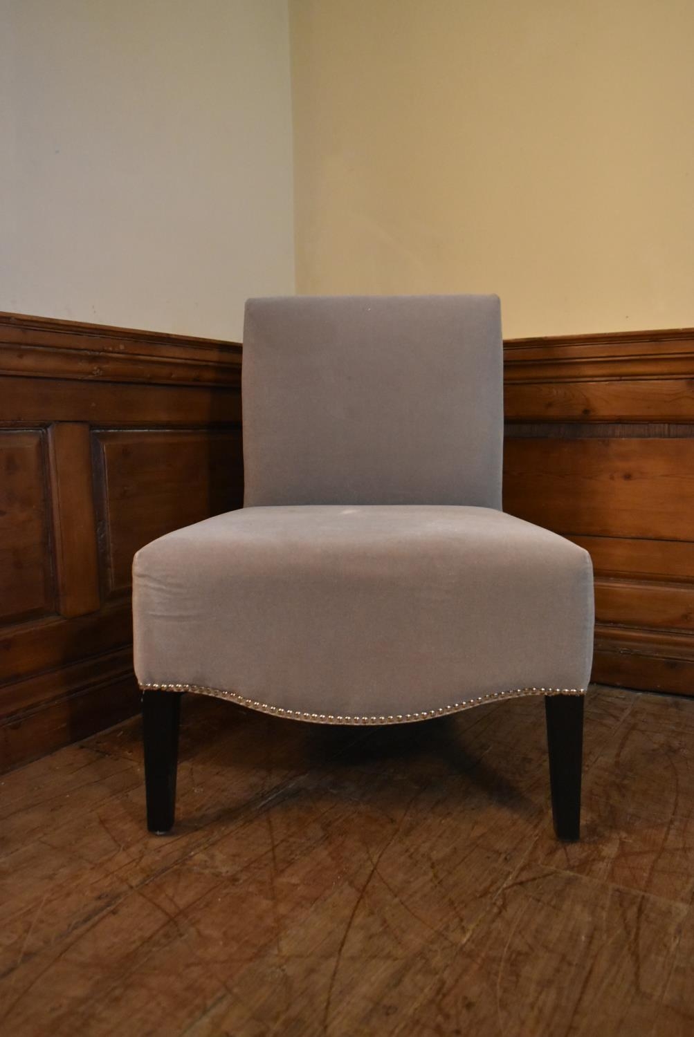 A contemporary nursing chair in velour upholstery. H.82 W.62 D.50cm