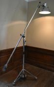 A mid century vintage chromium standard reading lamp. the lamp fitting fully articulated around