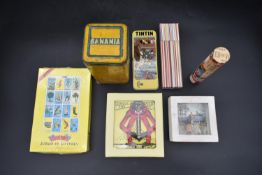 A vintage Banania tin, other novelty games, designer stationery etc. H.23 W.15cm (7)