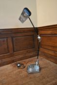 An Art Deco chrome anglepoise desk lamp on stepped base marked: Flexo. H.72 W.46cm