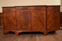 A Georgian style flame mahogany and satinwood strung breakfront sideboard. H.88 W.132 D.50cm