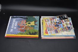 Four Tintin annuals, including The Adventures of Herge, The Adventures of Tintin in the Land of