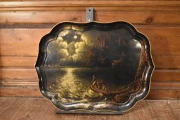 A large early 20th century lacquered and painted tray depicting fisherman with nets under moonlight.