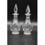 A pair of vintage crystal cut glass vinegar and oil bottles with tops. H.20cm (2)