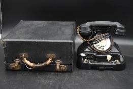 A cased 1930's Remington Noiseless Portable typewriter and an unusual early 20th century bakelite