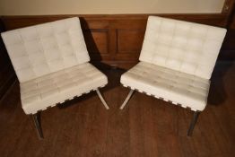 After Ludwig Mies van der Rohe, a pair of Barcelona chairs in white leather upholstery on chrome