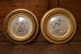 A pair of early 20th century Meissen style porcelain figural relief plaques of 'The Four Seasons'