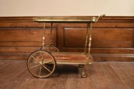 A vintage Italian brass framed kingwood and satinwood inlaid drinks trolley. H.69 W.83 D.46cm