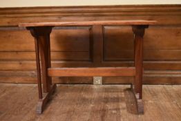 A late 19th century mahogany Arts and Crafts side table on stretchered platform supports. H.62 W.