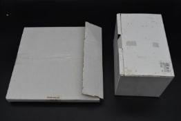 A boxed Maxim's plate and a boxed glass teapot with integral strainer. Dia.28cm (plate) H.13cm (