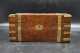 A mid 19th Century walnut and brass bound writing slope with fitted interior and two glass ink