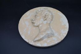 A plaster relief plaque with 19th century style gentleman's profile, indistinctly signed. Dia.30cm