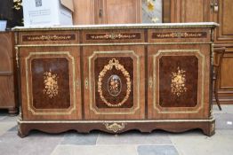 A French style burr walnut and crossbanded credenza with marble top and floral satinwood inlay