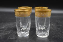 A set of four St Louis crystal gilded Thistle design water glasses. Maker's stamp to the base. H.9.5