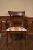A William IV mahogany bar back armchair with scroll arms and acanthus carved back splat and