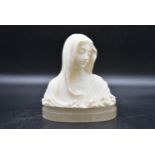 A 20th century alabaster female bust in the Pre-Raphaelite manner. H.18 W.24cm