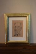 A gilt framed and glazed charcoal sketch, male portrait, monogrammed and dated. H.32 W.26cm