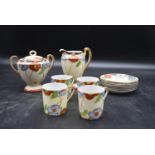 An Art Deco coffee set with hand painted foliate design, including four cups, six saucers, milk