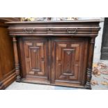 A 19th century French chestnut side cabinet with frieze drawers above lozenge panelled doors flanked