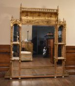 A late 19th century gilt and gesso overmantel mirror with swag and ribbon frieze above original