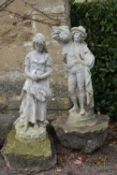 A pair of composite white painted garden statues of harvesters. H.100cm
