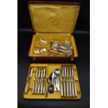 A 1920's silver plated cutlery set in a crocodile skin case fitted with lift out tray, including