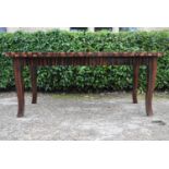 A contemporary zebra wood extending draw leaf dining table raised on square tapering shaped