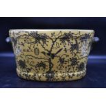 A Chinese porcelain footbath with hand painted foliate design, stamped to base. H.23 W.48 D.30cm