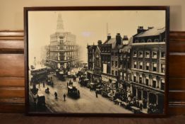 A large framed photographic reproduction of a London street scene C.1900. H.96 W.127cm