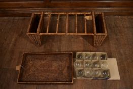A wicker double ended magazine rack, a wicker tray and twelve balloon wine glasses. H.7 W.55 D.