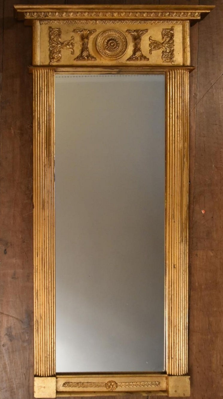 A Regency style giltwood and gesso pier mirror with architectural frieze decorated with acanthus and