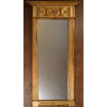 A Regency style giltwood and gesso pier mirror with architectural frieze decorated with acanthus and