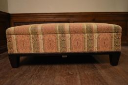 A large George Smith ottoman stool with hinged lid and striped floral upholstery on squat square