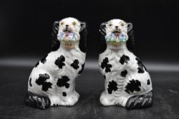 A pair of late 19th century ceramic Staffordshire dogs. H.22 W.12cm (2)
