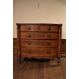 A mid Victorian mahogany bowfronted chest of two short above three long drawers flanked by