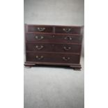 A Georgian mahogany chest of drawers on ogee bracket feet. (The bottom half of a chest on chest).