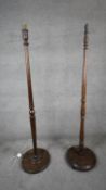 A mahogany turned standard lamp on platform base and another similar lamp. H158 W.38 D.38