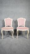 A pair of Louis XV style Rococo carved white painted salon chairs in velour upholstery. H.89 W.43