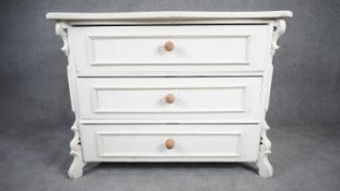 A 19th century french Provincial white painted chest of drawers. H.83 W.109 D.53