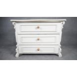 A 19th century french Provincial white painted chest of drawers. H.83 W.109 D.53
