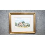 David Birtwhistle - A framed and glazed watercolour on paper of a landscape with cottage. Signed